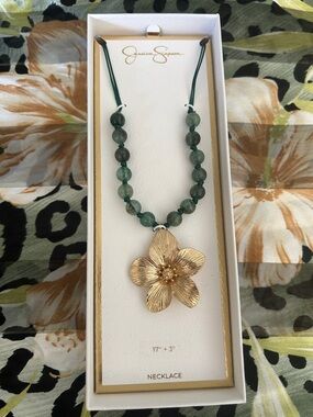 Jessica Simpson flower, pendant, and green acrylic bead cord necklace.